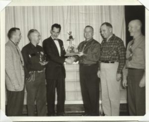 The trophy being presented in the 1950s.